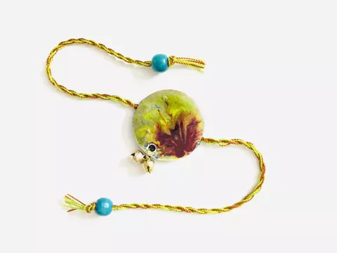 Auspicious Resin Rakhi Auspicious Resin Rakhi